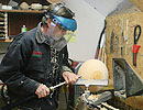 turning a wooden bowl on a lathe